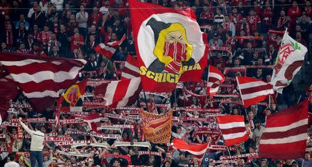 Soccer Football - Champions League - Bayern Munich vs Celtic - Allianz Arena, Munich, Germany - October 18, 2017 Bayern Munich fans hold up scarves and wave flags REUTERS/Michael Dalder