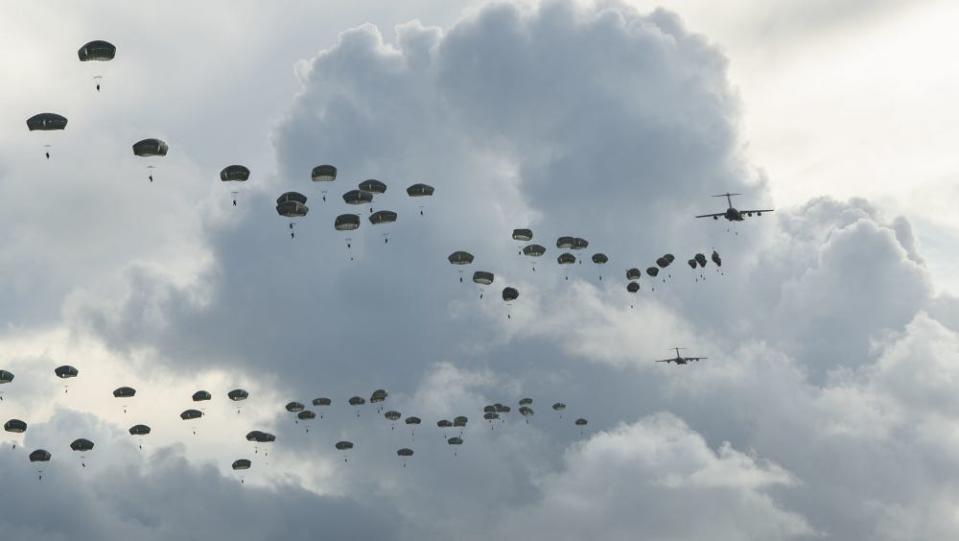 US Army paratroopers jump over Guam from US Air Force C-17 airlift planes