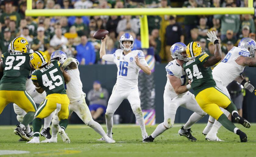 Detroit Lions quarterback Jared Goff (16) throws during a NFL football game against the Green Bay Packers Thursday, Sept. 28, 2023, in Green Bay, Wis. (AP Photo/Jeffrey Phelps)