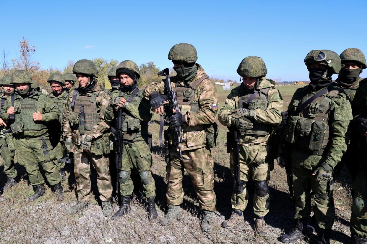 Russian army recruits listen to an instructor during a military training at a firing range in Donetsk People's Republic controlled by Russia-backed separatists, eastern Ukraine, Wednesday, Oct. 5, 2022.