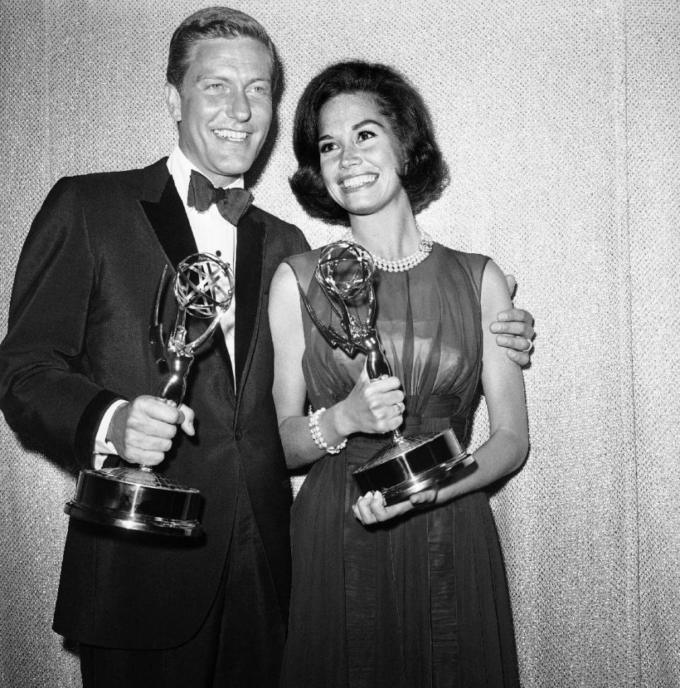 FILE - Dick Van Dyke, left, and Mary Tyler Moore co-stars of The Dick Van Dyke Show pose backstage at the Palladium with the Emmys won in the Television Academy's 16th annual awards show, in Los Angeles, Calif. They won the Emmy Award for best actor and actress in a series. Van Dyke is the recipient of the Life Achievement Award at the upcoming 19th Annual SAG Awards ceremony on Sunday, Jan. 27, 2013. (AP Photo, File)