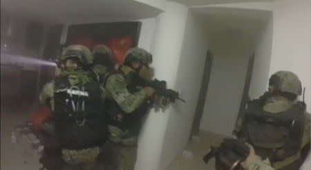 Mexican Marines take part in an operation to capture drug boss Joaquin "El Chapo" Guzman in Los Mochis, Sinaloa, Mexico, in this still image taken from a January 8, 2016 video released by the Mexican Navy on January 11, 2016. REUTERS/Mexican Navy/Handout via Reuters TV