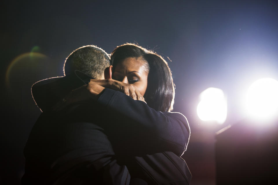 The Obamas hug at a campaign rally in Des Moines, Iowa.