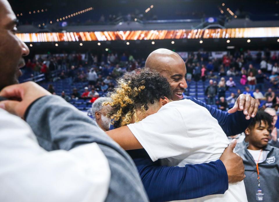 Warren Central head coach William Unseld hugs his son Kade Unseld after defeating George Rogers Clark and winning the 2023 Boys Sweet 16 Championship at Saturday's second KHSAA Boys Sweet 16 Final in Rupp Arena. March 18, 2023 