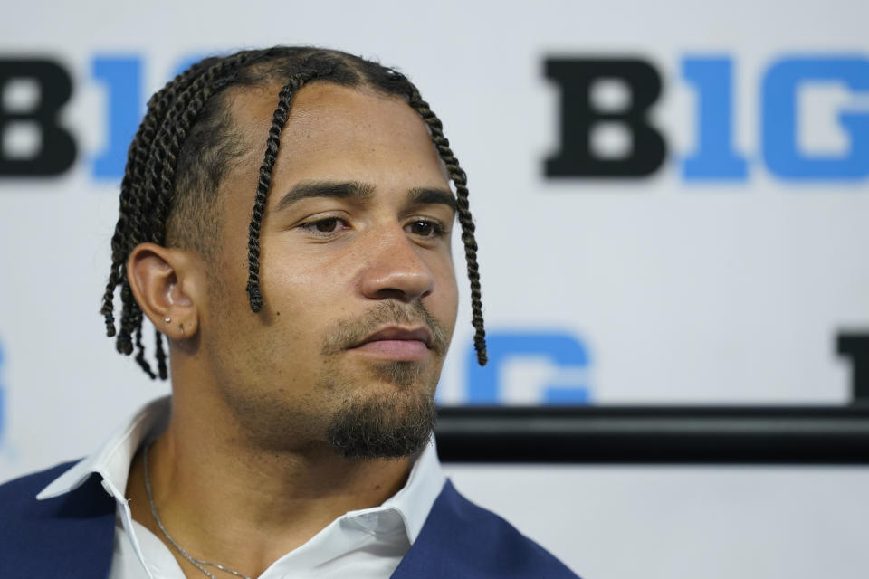 Illinois running back Chase Brown talks to reporters during an NCAA college football news conference at the Big Ten Conference media days, at Lucas Oil Stadium, Wednesday, July 27, 2022, in Indianapolis. (AP Photo/Darron Cummings)