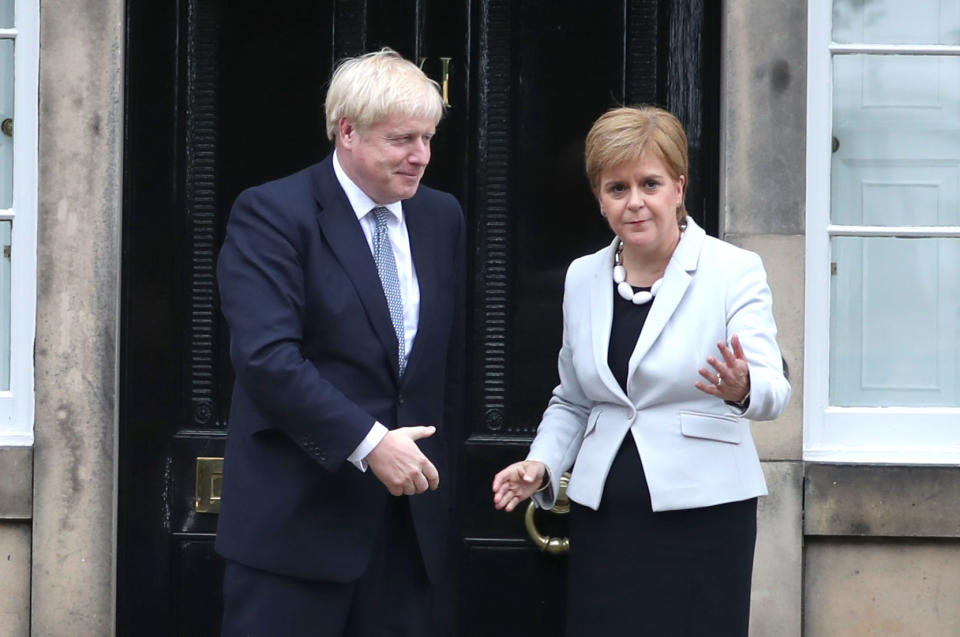 RETRANSMITTED CORRECTING BYLINE Scotland's First Minister Nicola Sturgeon welcomes Prime Minister Boris Johnson outside Bute House in Edinburgh ahead of their meeting.