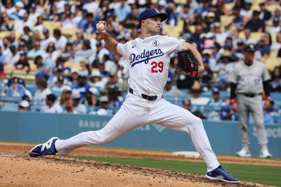 Dodgers pitcher Michael Grove delivers during the seventh inning against the Rockies on Sunday.