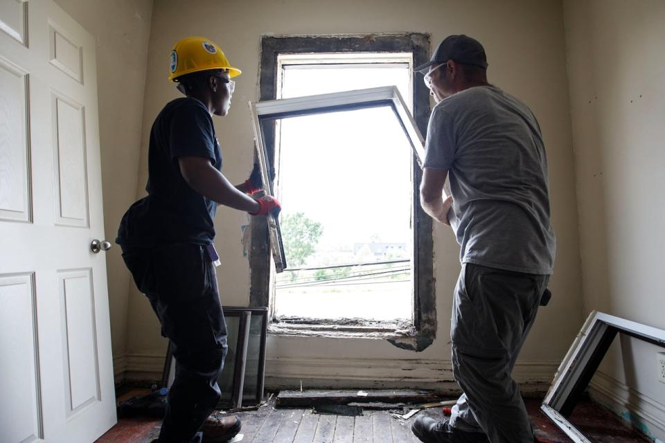 Tim Zubek, site supervisor with Building Up, and Dorine Khainza, an apprentice, are photographed inside of a Toronto home under construction on July 6, 2023. Building Up, a non-profit social enterprise, is hiring individuals who face barriers to employment to work as apprentices on green renovations for homes in lower income neighbourhoods. 