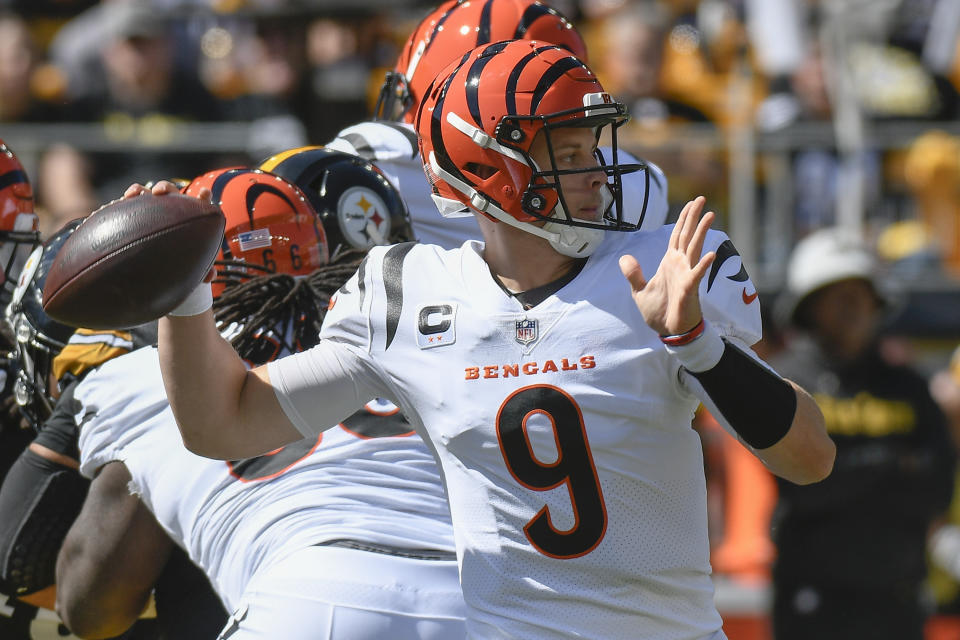 Cincinnati Bengals quarterback Joe Burrow (9) passes against the Pittsburgh Steelers during the first half an NFL football game, Sunday, Sept. 26, 2021, in Pittsburgh. (AP Photo/Don Wright)