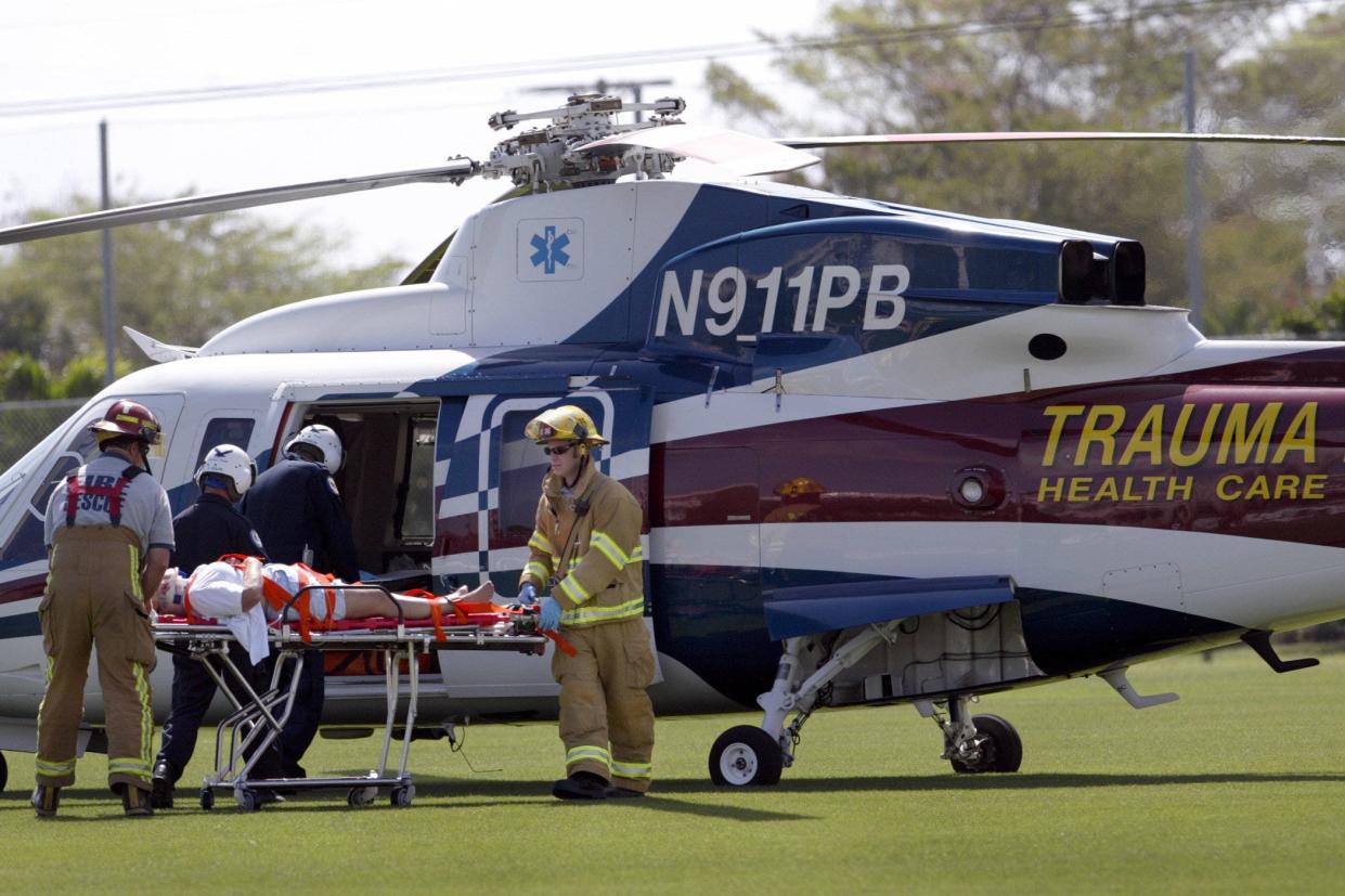 A 62-year-old women was taken to a hospital by Trauma Hawk after she was hit by a car while riding her bike in this photo circa 2004. She was wearing a helmet. The accident occurred on Dixie Highway just north of Lantana Road.