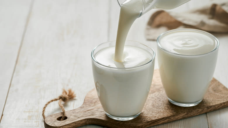 kefir pouring in two cups