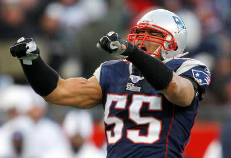 FILE PHOTO: New England Patriots linebacker Junior Seau celebrates sacking San Diego Chargers quarterback Philip Rivers in first quarter of the NFL's AFC championship football game in Foxborough, Massachusetts January 20, 2008. REUTERS/Brian Snyder/File Photo