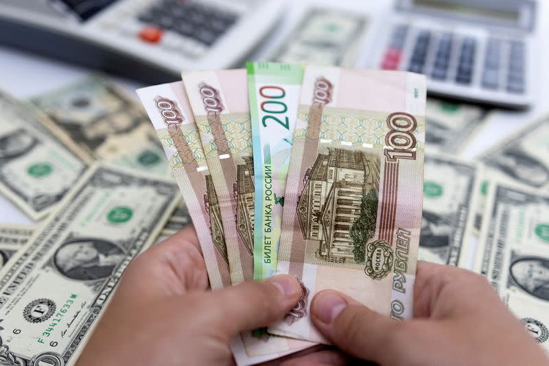 FILE PHOTO: Illustration shows Russian Rouble and U.S. Dollar banknotes