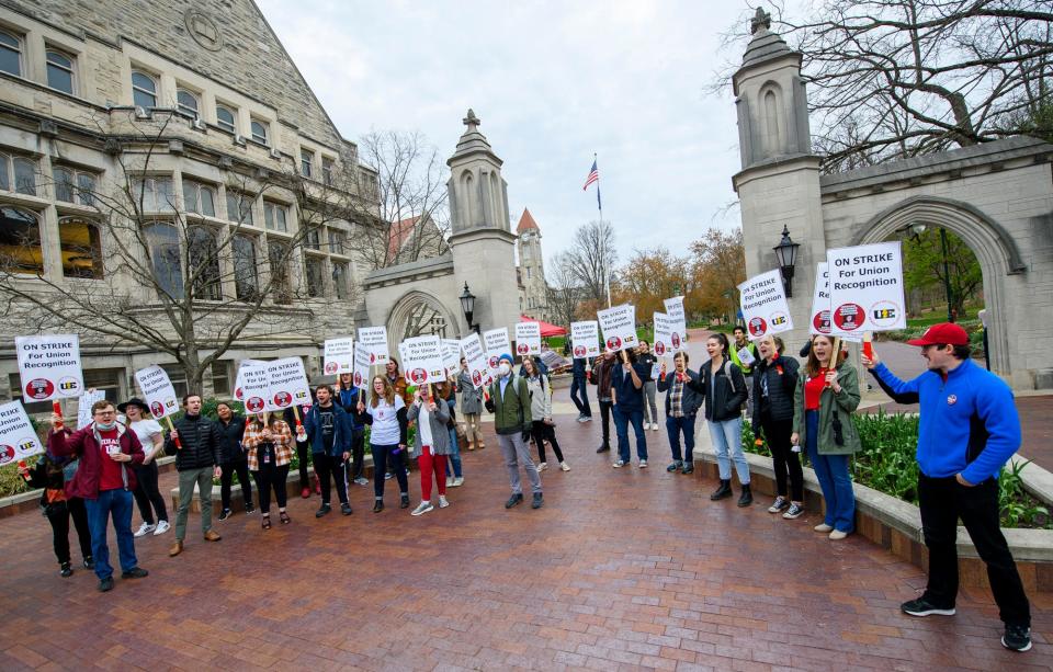 Picketers demonstrate support of the graduate workers strike at the Sample Gates on Wednesday, April 20, 2022.