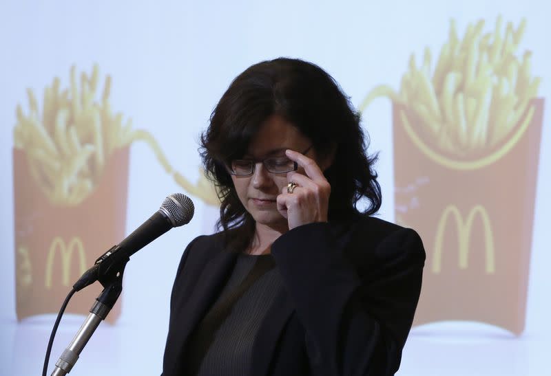 McDonald's Holdings Co (Japan) President and Chief Executive Officer (CEO) Sarah Casanova touches her glasses as she attends a news conference in Tokyo July 29, 2014. REUTERS/Yuya Shino