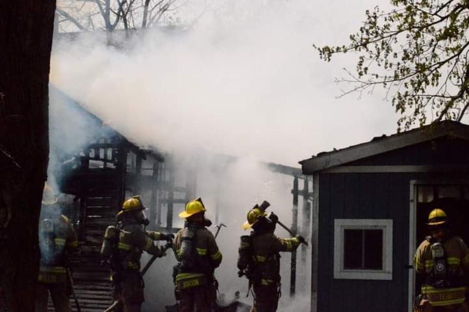 Firefighters battle a blaze in the 100 block of Argyle St. in Jackson Friday. (Courtesy Michigan Fire Alerts)