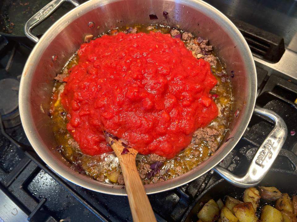 Adding tomatoes for Best Damn Chili