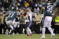 New England Patriots' Julian Edelman (11) throws a touchdown pass during the second half of an NFL football game against the Philadelphia Eagles, Sunday, Nov. 17, 2019, in Philadelphia. (AP Photo/Matt Rourke)