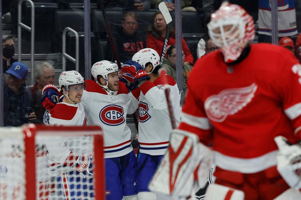 Canadiens left wing Mike Hoffman, center, receives congratulations from teammates after scoring in the first period in the first period on Tuesday, Nov. 8, 2022, at Little Caesars Arena.