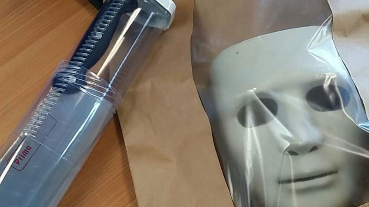 Police shared a photo of the mask and knife on Twitter