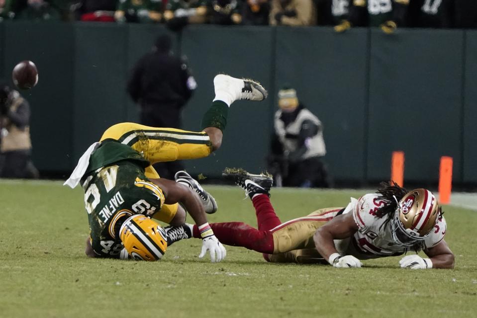 San Francisco 49ers' Fred Warner breaks up a pass intended for Green Bay Packers' Dominique Dafneyduring the first half of an NFC divisional playoff NFL football game Saturday, Jan. 22, 2022, in Green Bay, Wis. (AP Photo/Morry Gash)