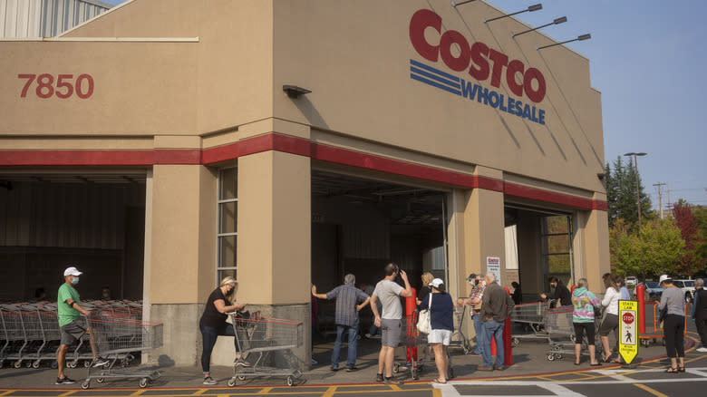 shoppers outside Costco store