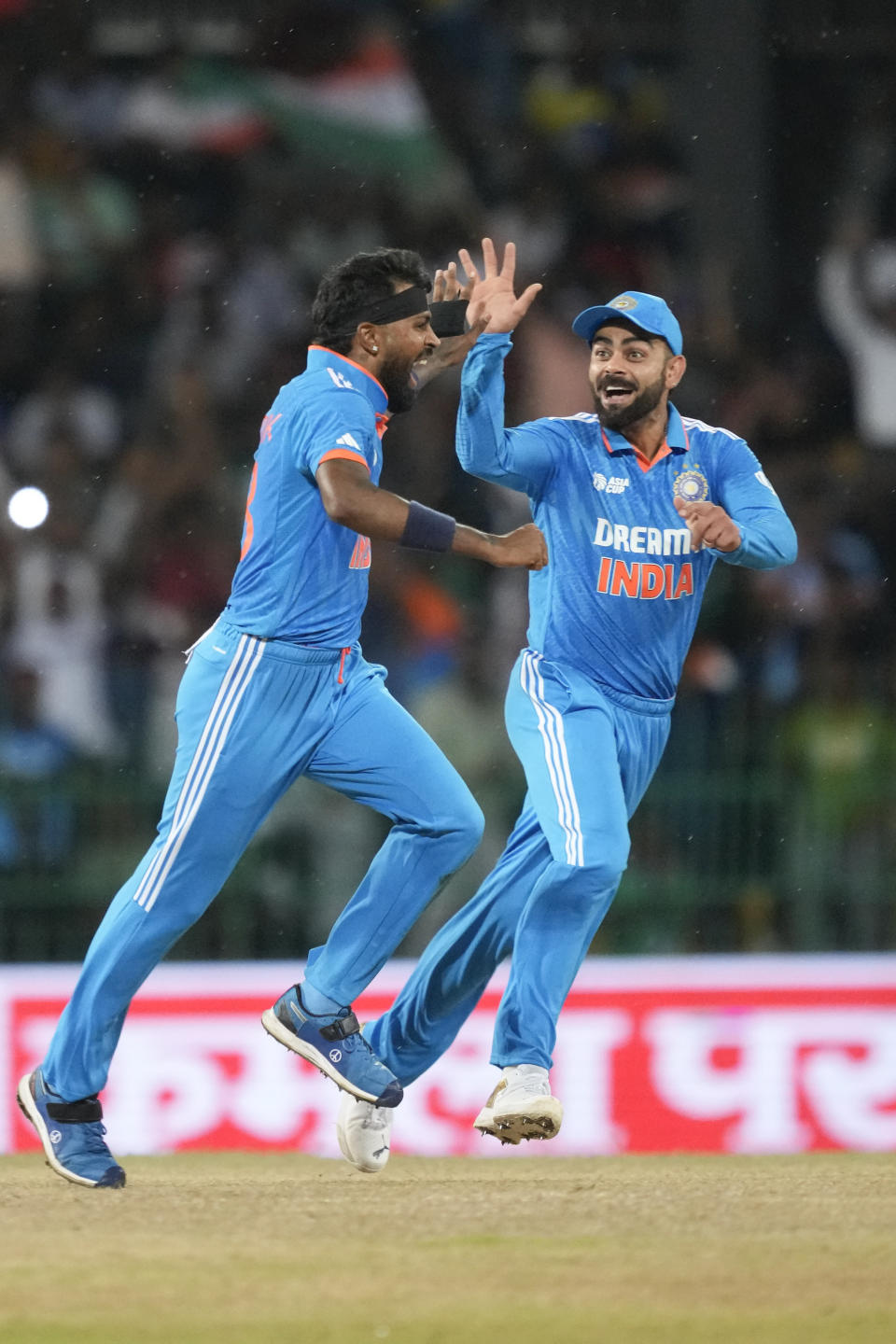 India's Hardik Pandya, left, and Virat Kohli celebrates the wicket of Pakistan's Babar Azam during the Asia Cup cricket match between India and Pakistan in Colombo, Sri Lanka on Monday, Sept.11, 2023. (AP Photo/Eranga Jayawardena)