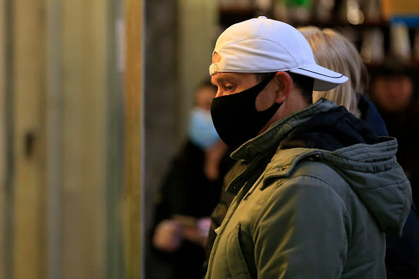 People are seen wearing face masks while shopping at the Queen Victoria Market in Melbourne, Australia. 