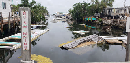 A debris-filled canal is seen, almost a year after Hurricane Irma, in Marathon, Florida, U.S., June 10, 2018. Picture taken June 10, 2018. REUTERS/Zach Fagenson