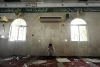 A Saudi man reacts following a blast inside a mosque, in the mainly Shiite Saudi Gulf coastal town of Qatif on May 22, 2015