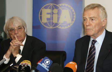 International Automobile Federation (FIA) President Max Mosley (R) and Formula One commercial supremo Bernie Ecclestone attend a meeting in Paris June 24, 2009. REUTERS/Gareth Watkins