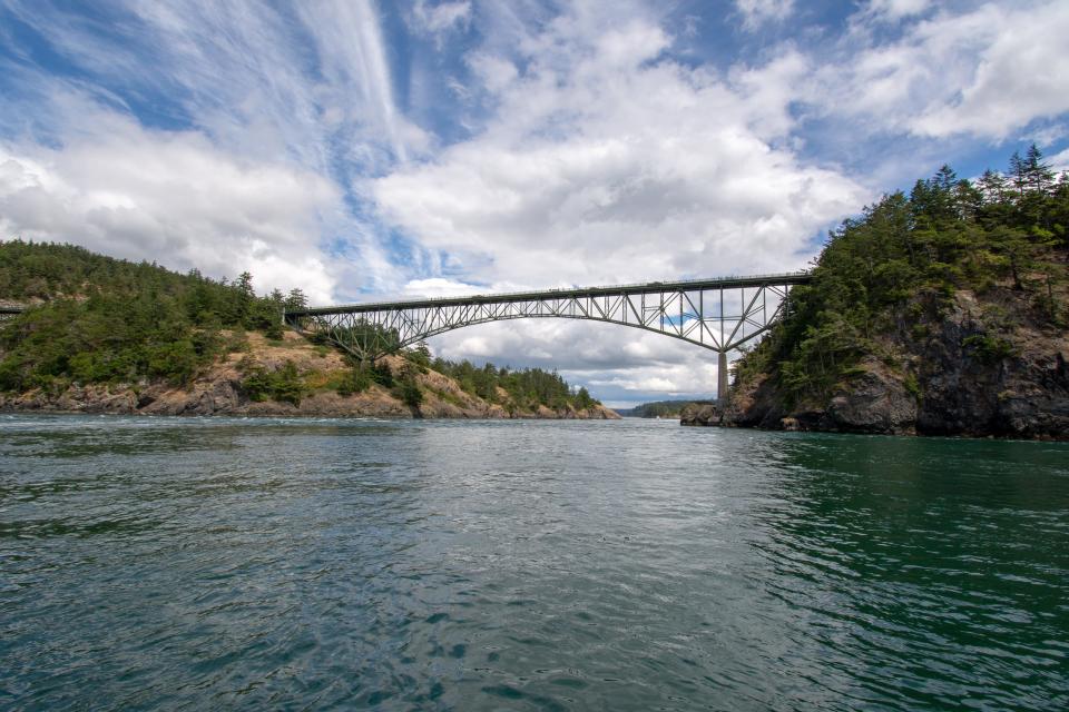 Deception Pass Bridge is two lanes and towers over the Puget Sound. The iconic bridge is in Deception Pass State Park and opened to drivers and pedestrians in 1935.
