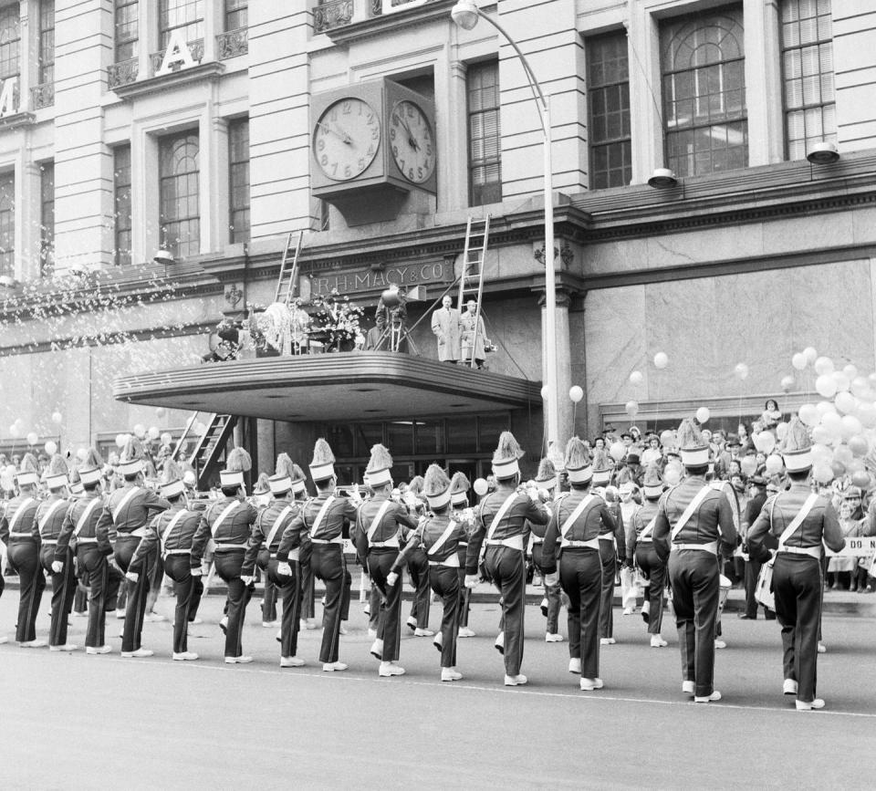 <p>A marching band performs in front of Macy's at the 1954 parade.</p>