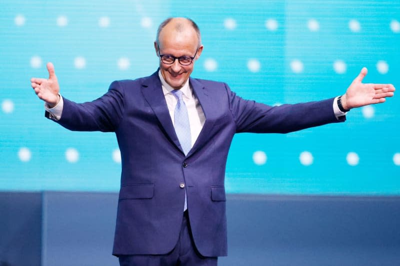 Friedrich Merz, Federal Chairman of the Christian Democratic Union (CDU), waves after his speech during the CDU Federal Party Conference. Michael Kappeler/dpa