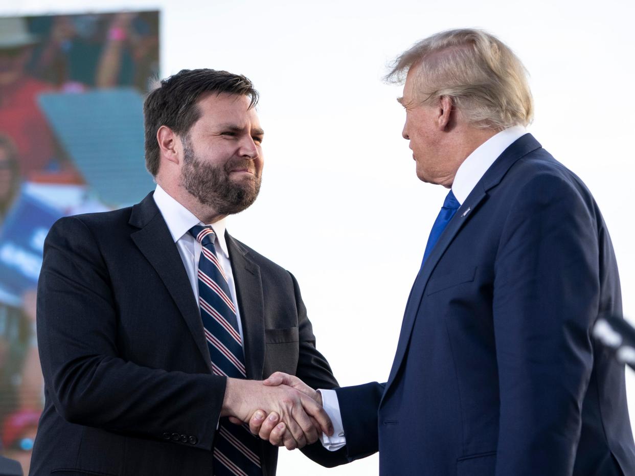 J.D. Vance, a Republican candidate for U.S. Senate in Ohio, shakes hands with former President Donald Trump during a rally hosted by the former president at the Delaware County Fairgrounds on April 23, 2022 in Delaware, Ohio. Last week, Trump announced his endorsement of J.D. Vance in the Ohio Republican Senate primary.