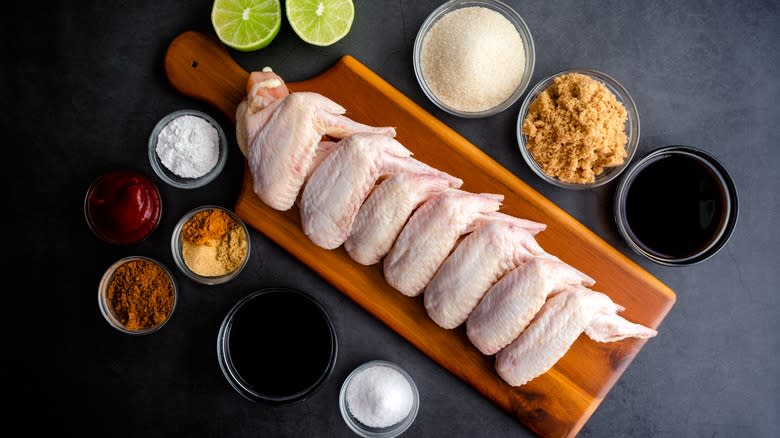 Raw chicken wings and spices