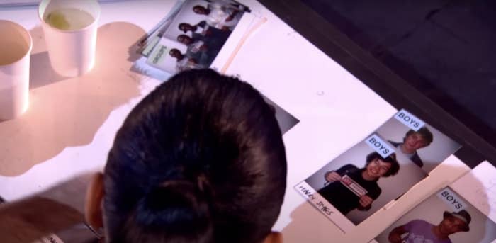 A view over Nicole's shoulder of her pairing photos of Niall and Harry