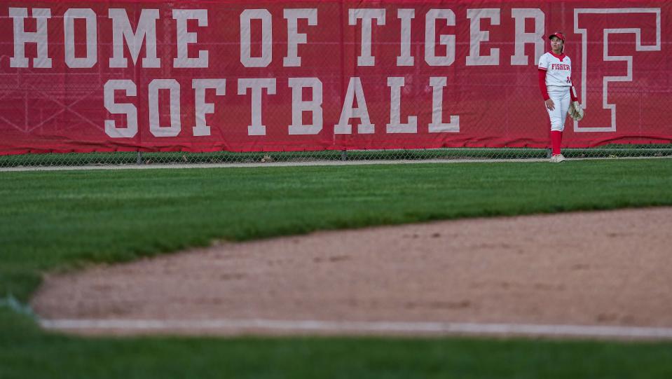 Fishers Tigers Jenna Grubb (11) stands in the outfield during the game against the Hamilton Southeastern Royals on Tuesday, April 25, 2023 at Fishers High School in Fishers. The Fishers Tigers defeated the Hamilton Southeastern Royals, 1-0. 