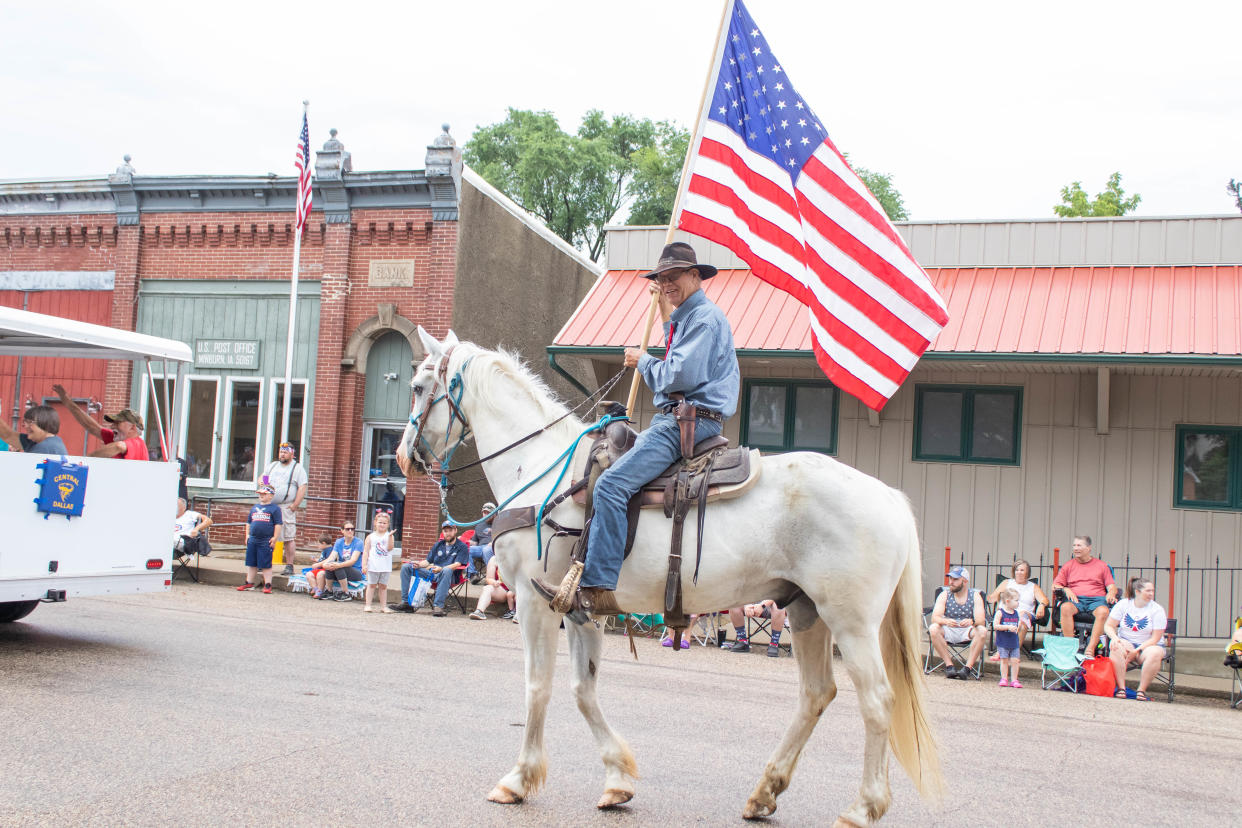 Horses are ridden during the Fourth of July parade on Monday, July 4, 2022, in Minburn.
