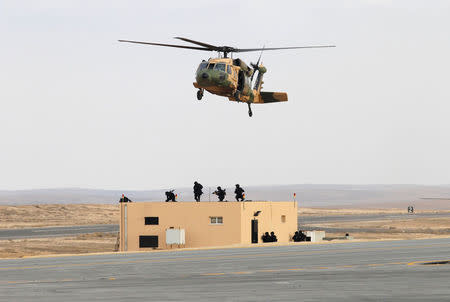 Jordanian army members participate in a hostage rescue drill during a Black Hawk helicopters handover ceremony to Jordan from the U.S. government, at a Jordanian military base near the town of Zarqa, Jordan, January 28, 2018.REUTERS/Stringer