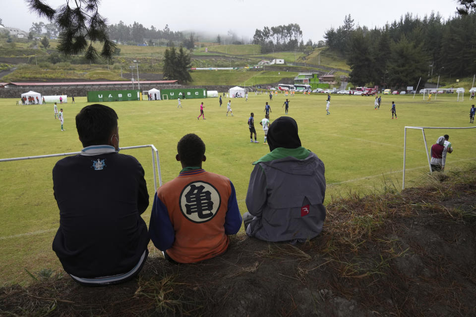 Soccer fans watch Independiente del Valle under-17 youth team play against Mushuc Runa in Tisaleo, Ecuador, Saturday, Sept. 3, 2022. The club trains young men in soccer while providing them with up to a high school graduation and has become a key source for the country’s national soccer team. (AP Photo/Dolores Ochoa)