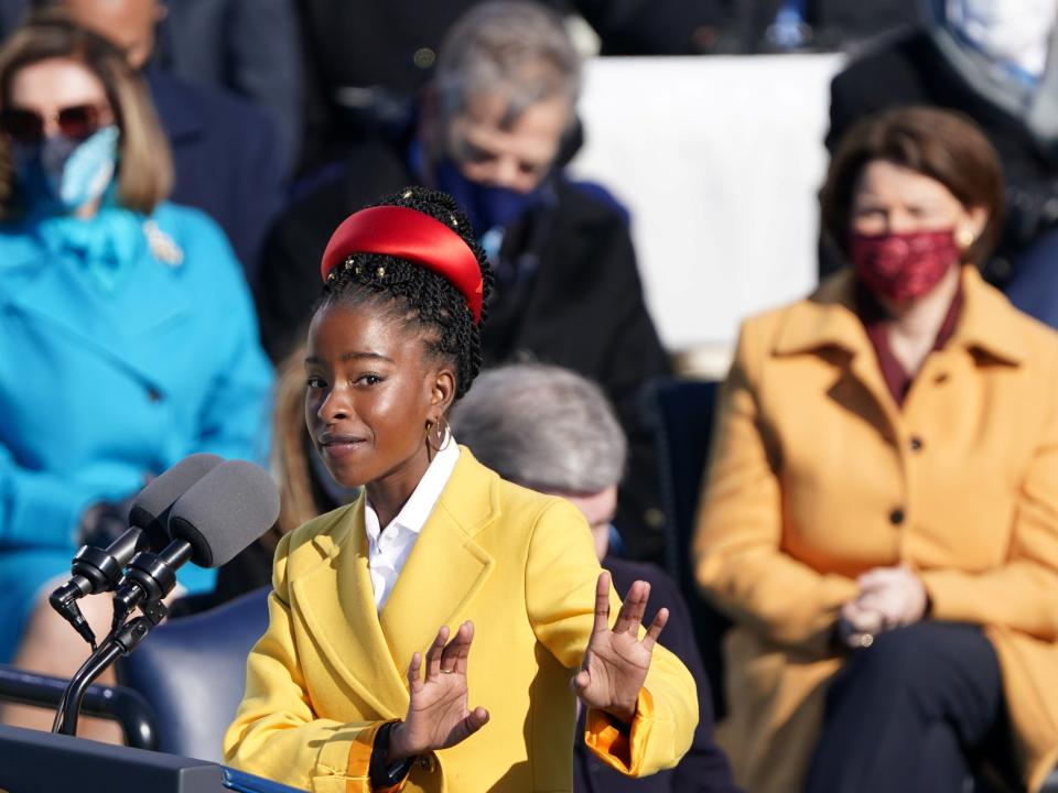 Amanda Gorman recites a poem during the inauguration of Joe Biden, referencing Biblical scripture and at times echoing the oratory of John F Kennedy and the Rev Martin Luther King Jr as she asked: ‘Where can we find light/In this never-ending shade?’REUTERS