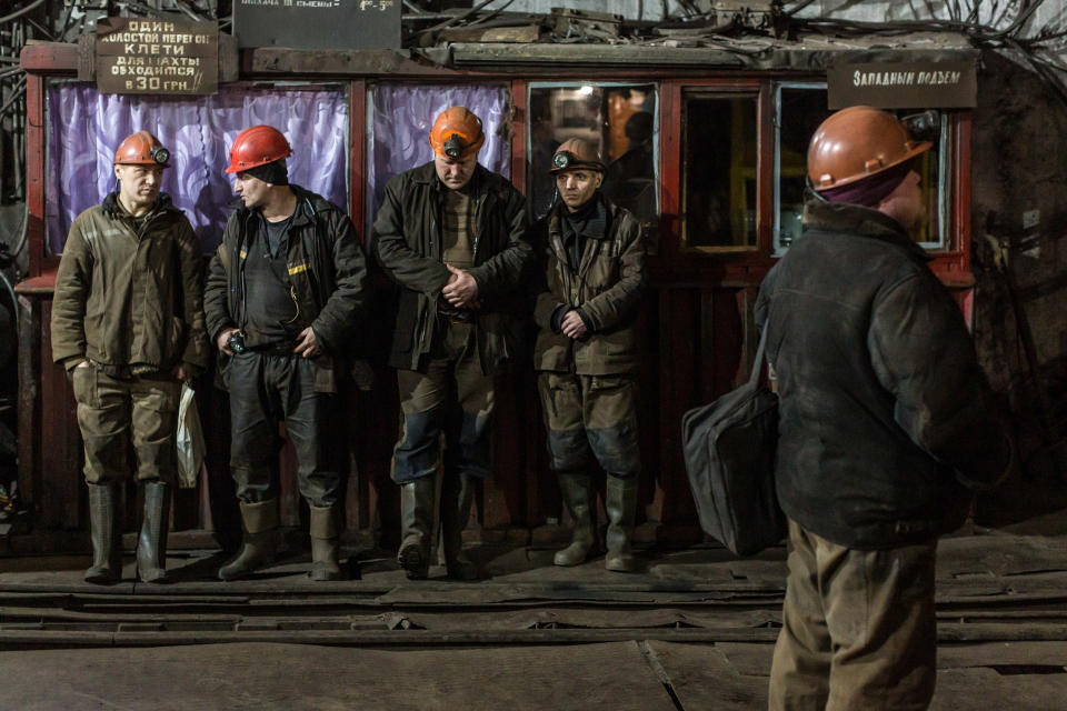 Image: Miners wait for the elevator that will take them for the 6-hour shift underground at the Tsentralna coal mine in Toretsk, Donetsk region, Ukraine (Oksana Parafeniuk / for NBC News)