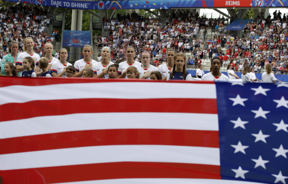 US team players during the singing of their national anthem ahead of the Women's World Cup round of 16 soccer match between Spain and US at the Stade Auguste-Delaune in Reims, France, Monday, June 24, 2019. (AP Photo/Alessandra Tarantino)