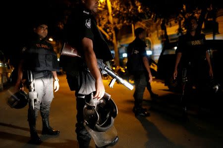 Security personnel keep watch, after gunmen stormed the Holey Artisan restaurant and took hostages, in the Gulshan area of Dhaka, Bangladesh July 2, 2016. REUTERS/Mohammad Ponir Hossain