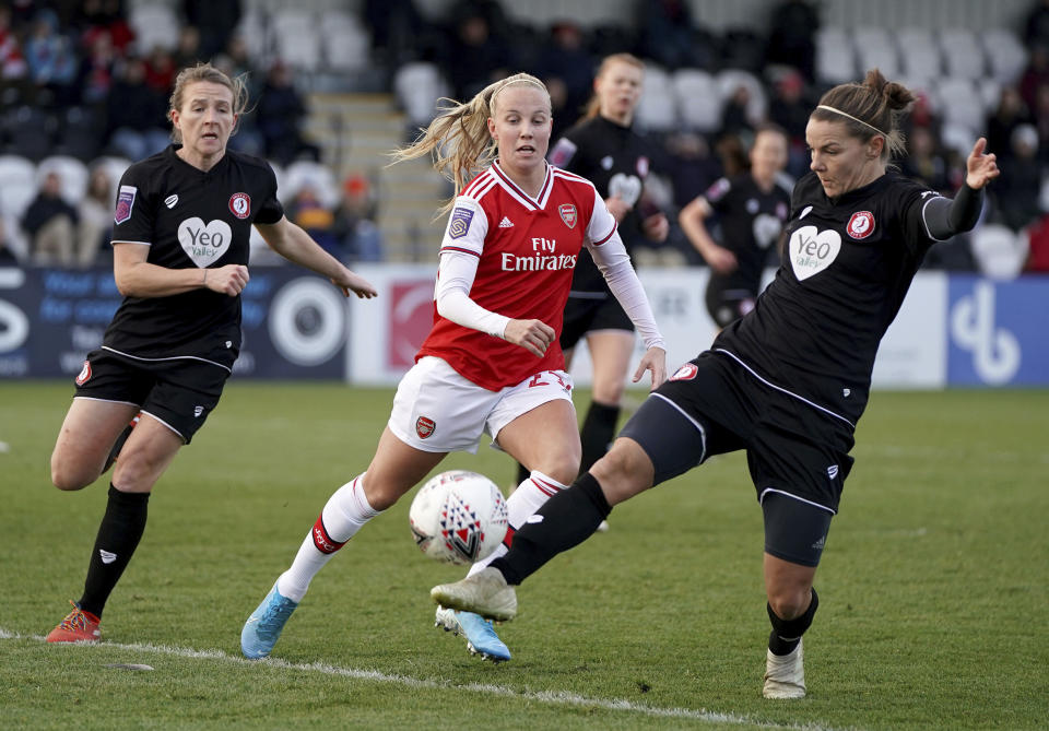Arsenal's Beth Mead and Bristol City's Loren Dykes, right, battle for the ball during the FA Women's Super League match against Bristol City at Meadow Park, Borehamwood, England, Sunday Dec. 1, 2019. (Tess Derry/PA via AP)
