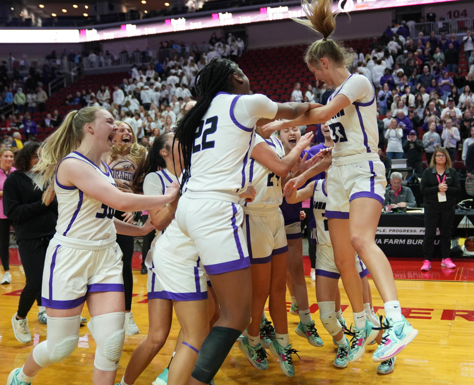 Johnston celebrates a win against Ankeny Centennial in their semifinal 5A matchup at Wells Fargo Arena on Thursday.