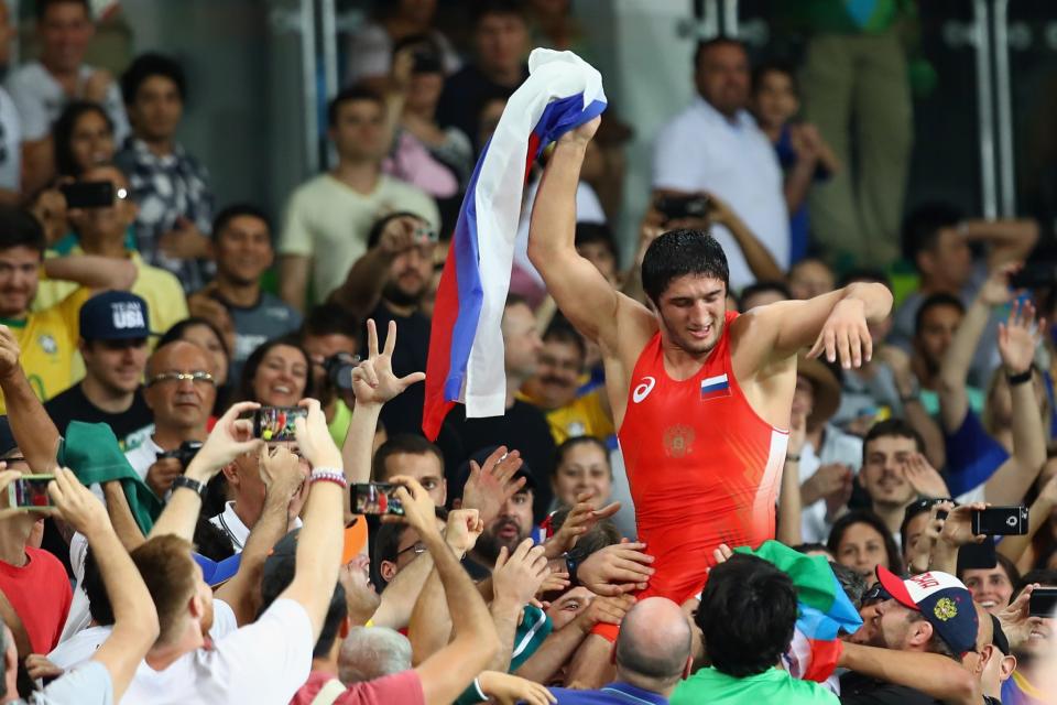 <p>Abdulrashid Sadulaev of Russia celebrates victory over Selim Yasar of Turkey in the Men’s Freestyle 86kg Gold Medal bout on Day 15 of the Rio 2016 Olympic Games at Carioca Arena 2 on August 20, 2016 in Rio de Janeiro, Brazil. (Photo by Clive Brunskill/Getty Images) </p>