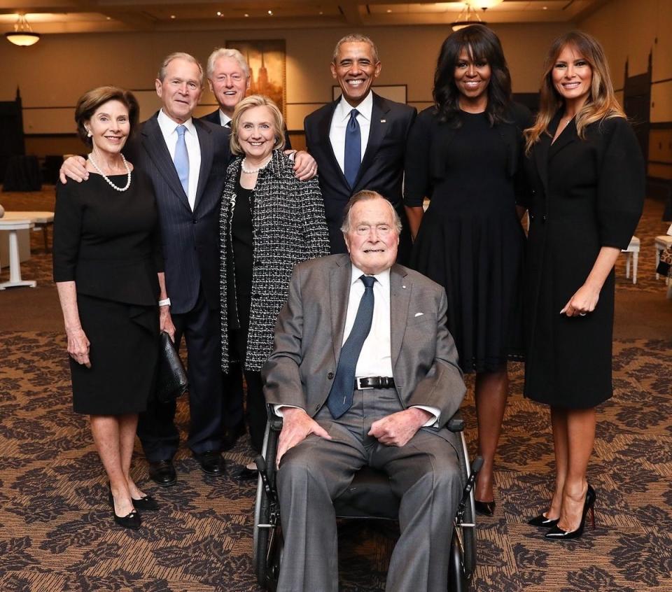 A photo taken at Barbara Bush's funeral features the Clintons, Obamas, Melania Trump, George H.W. Bush, George W. Bush, and Laura Bush sharing a moment.