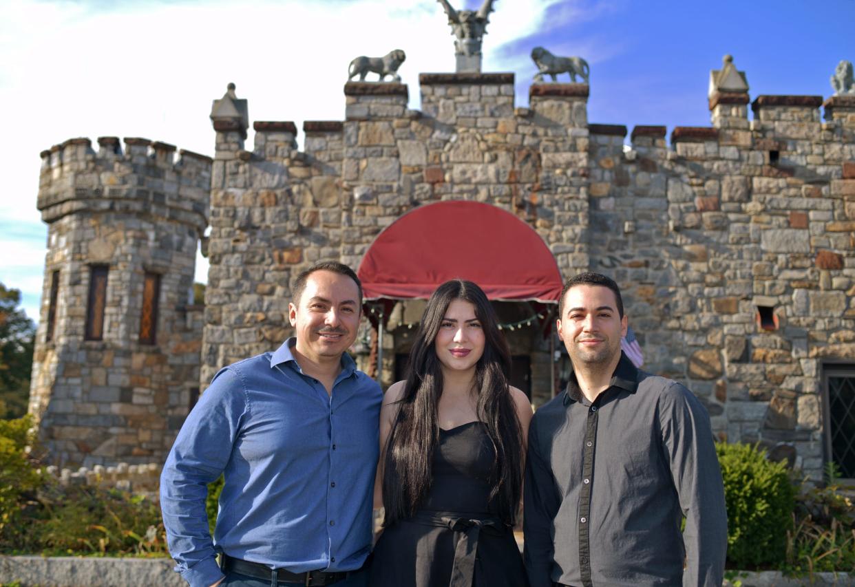 Jose Flores and wife Suhaily Quinones and Suhaily's brother Carlos Quinones are pictured in front of what is now Castle Cantina.